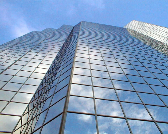 a picture of an office building looking up from the ground