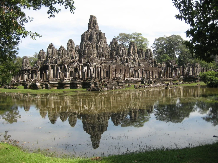 some of the ruins in angboden's bay area reflect in the still waters