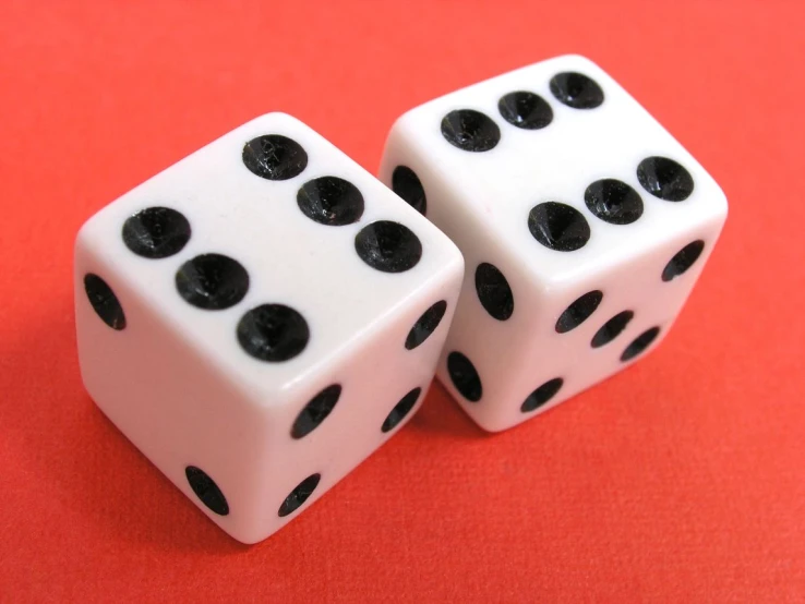 a close up of two dices on a table