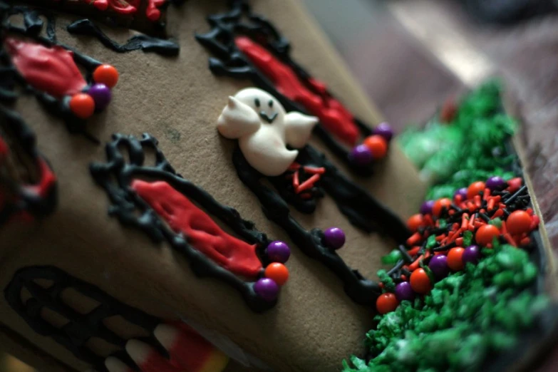 a decorated cake with black and green icing