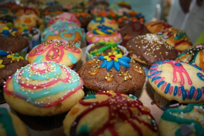 a collection of delicious looking decorated cup cakes