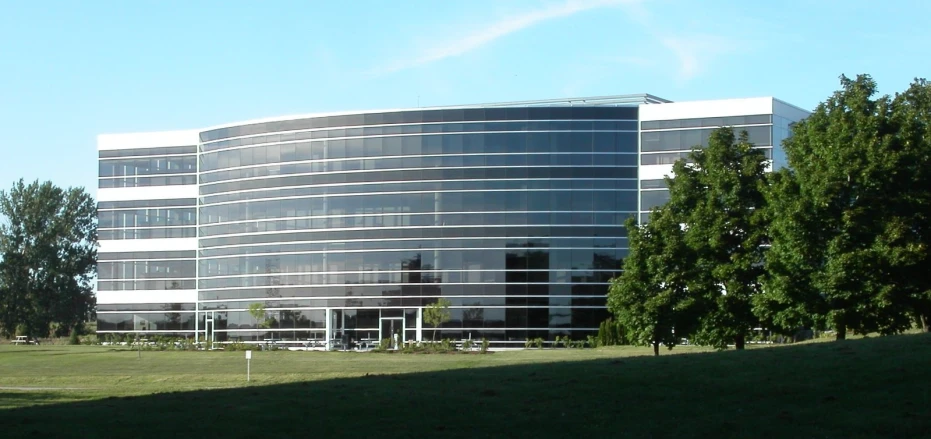 a building sits next to some trees