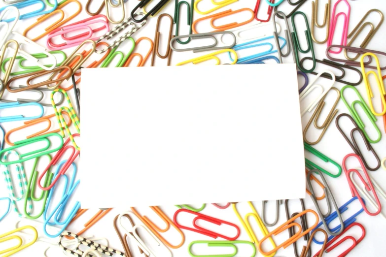 colorful colored paper clips with a white square top