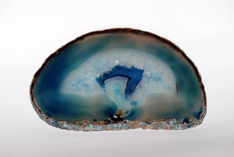 blue agate glass with white background and blue sky above