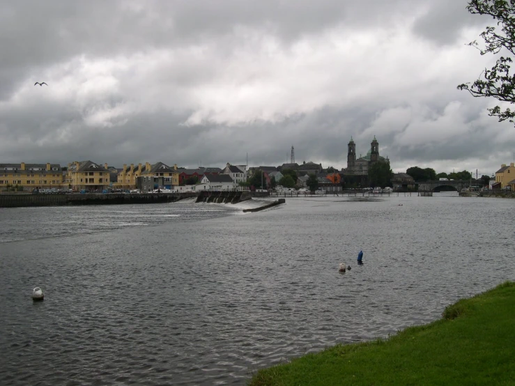 the people are standing in the river and fishing