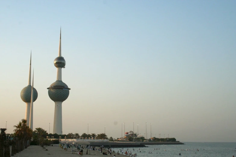 a large body of water with two large towers in the background