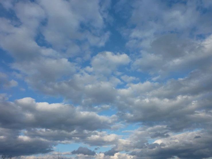 clouds and blue sky in the distance in a small town