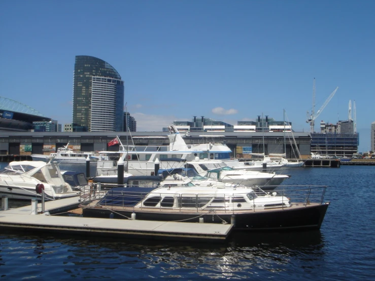 a few boats docked on the side of a body of water