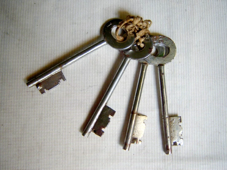 multiple keys sitting on top of a surface