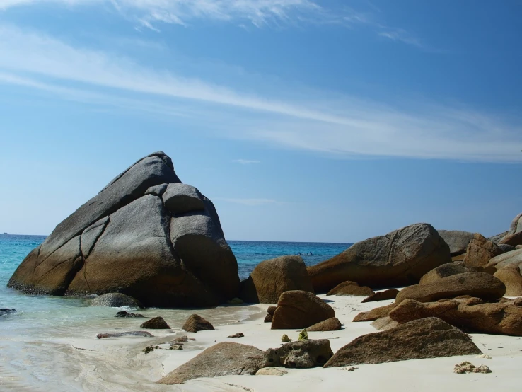 an image of the ocean and rocks near the shore