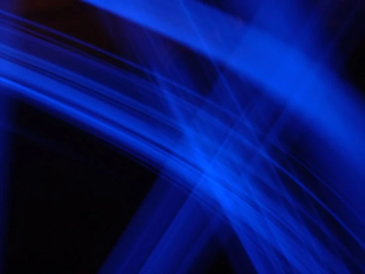 a blurry image of a bright blue abstract line