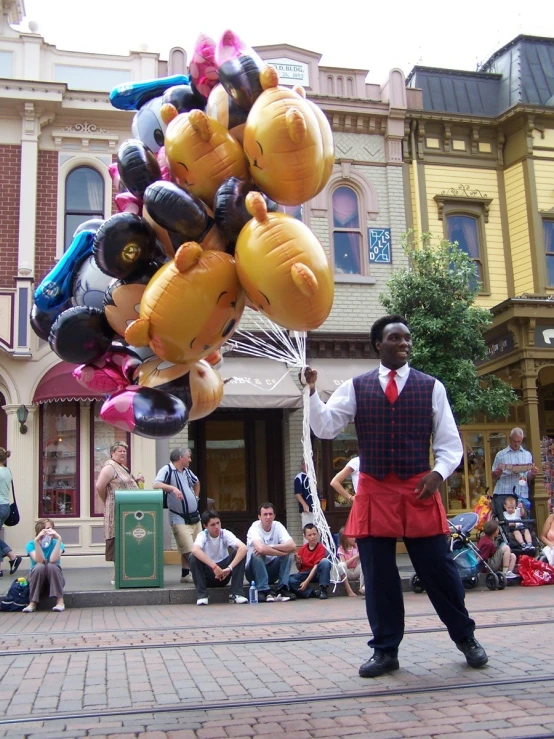 man standing in the street selling balloons