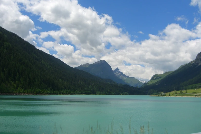 a very pretty lake surrounded by mountains and forest