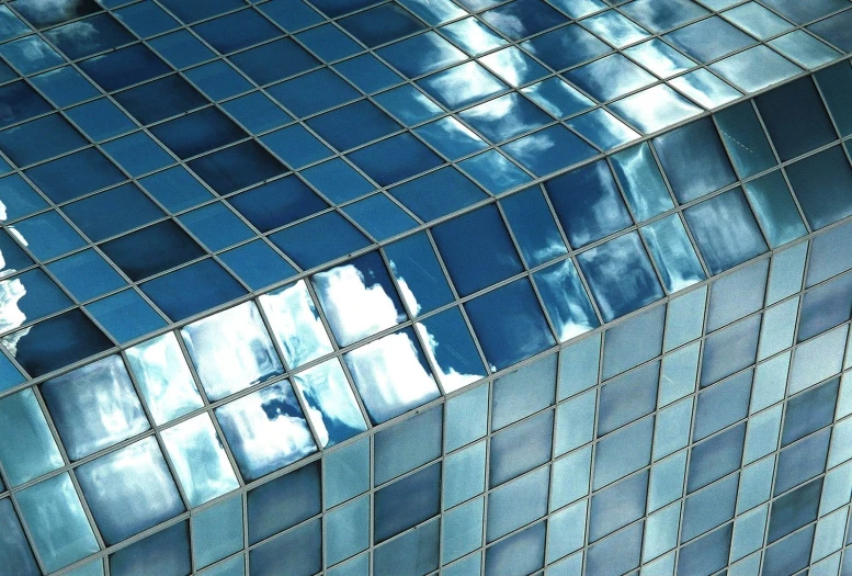 an interesting image of a tiled surface with blue colors