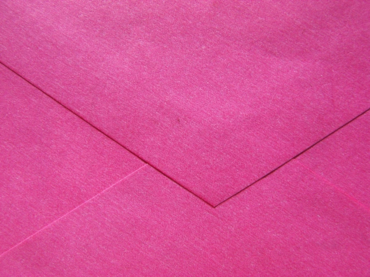 an open red envelope that is covered in shiny paper