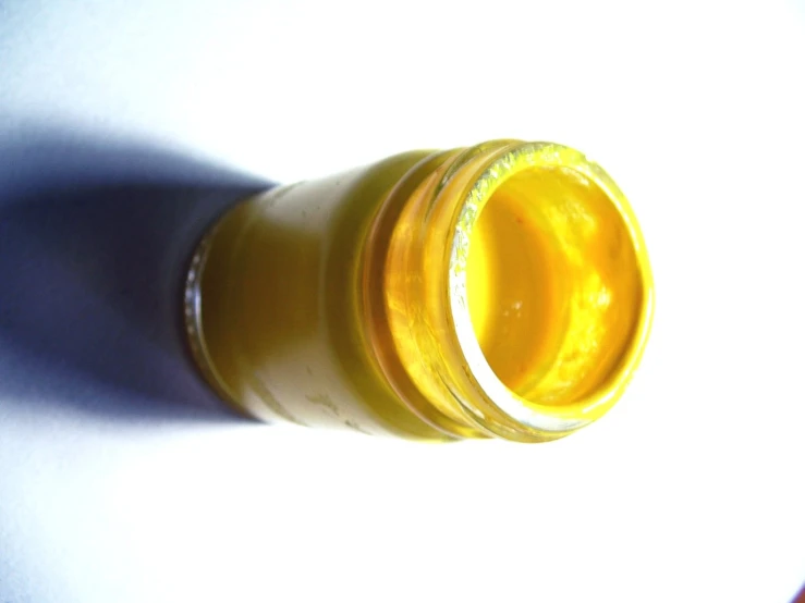 a bottle is shown in sunlight and a shadow