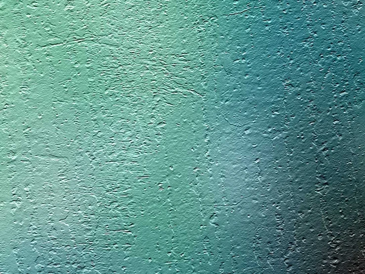 an up close s of a green colored wallpaper with water drops