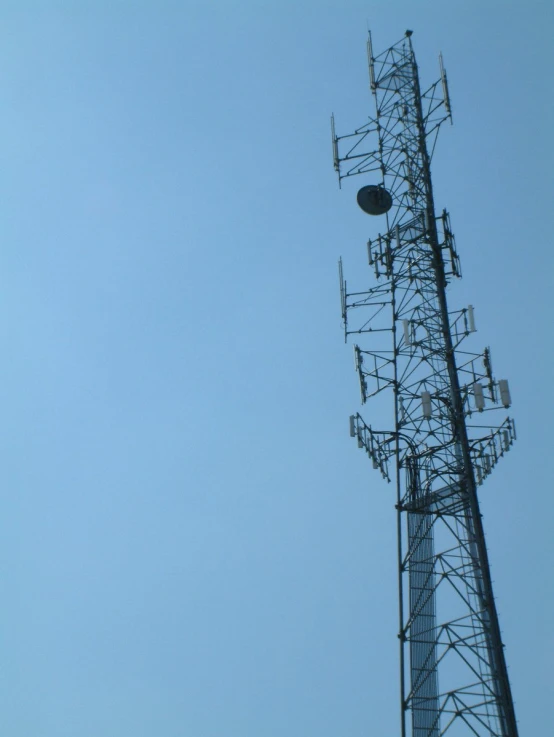 an old cell phone tower with antennas and lights