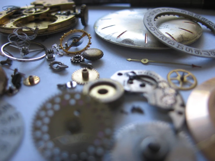 several different types of pocket watches sitting on a table