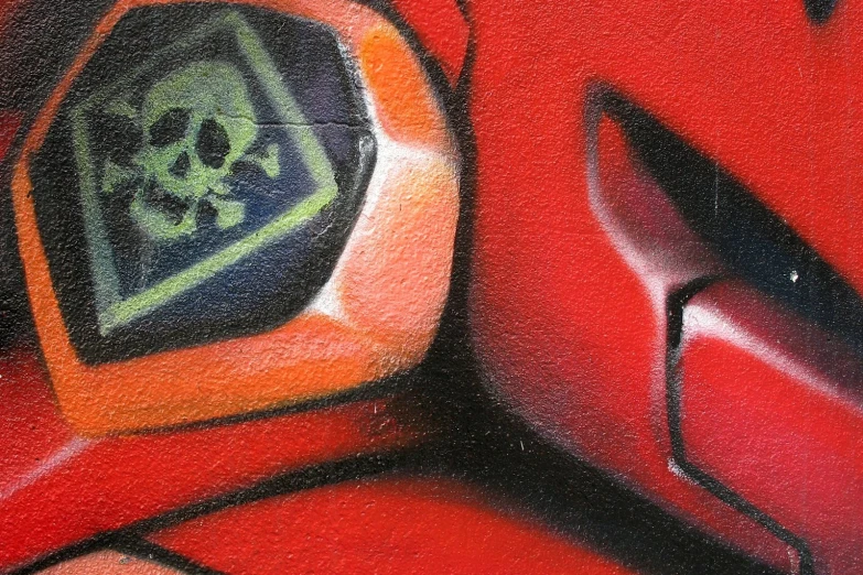 graffiti art of two skulls with bones on them