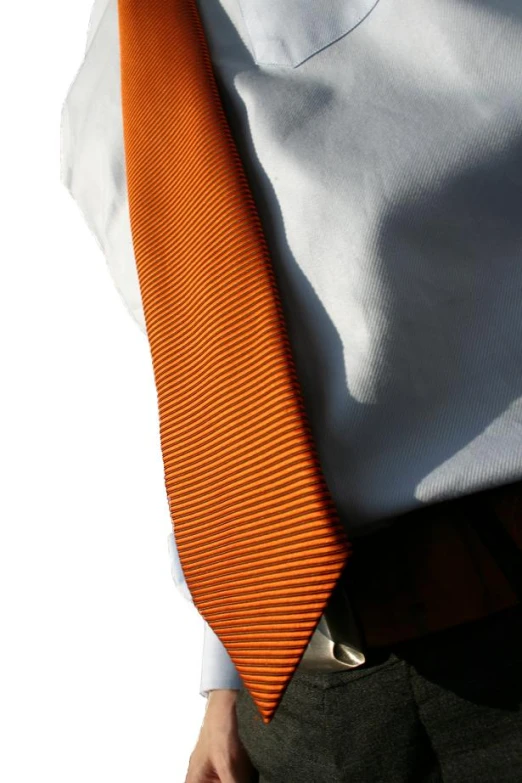 an orange striped tie is on top of a man's white shirt