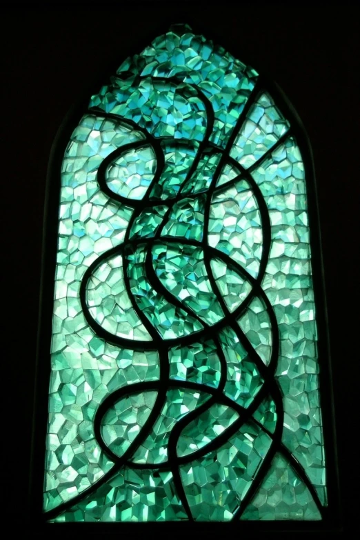 a close up of a stained glass window with curved lines