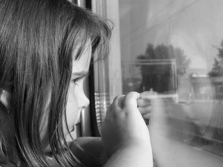 a little girl holding soing in her right hand