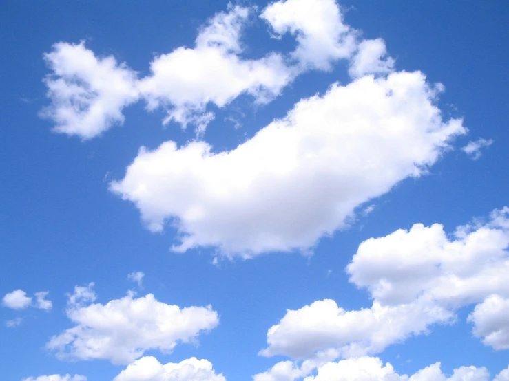 three airplanes are seen flying through the sky