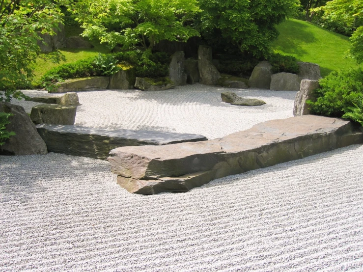 a stone walkway in an empty space in the park