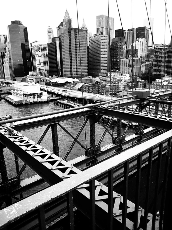 a dock filled with lots of boats and lots of tall buildings