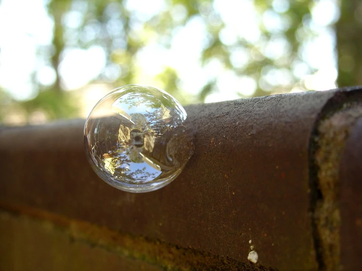 some kind of small crystal ball attached to a piece of metal