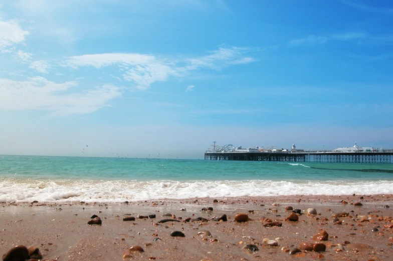 the water is turquoise and green on a clear day