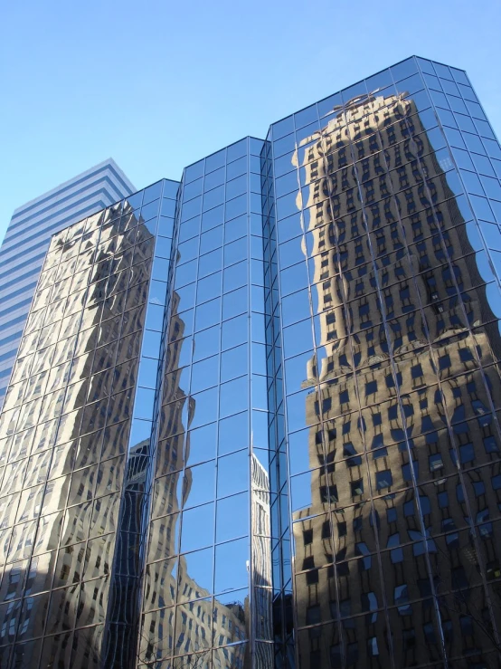 a reflection in the front of several building