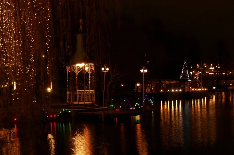 the lights are shining brightly on the lake's surface