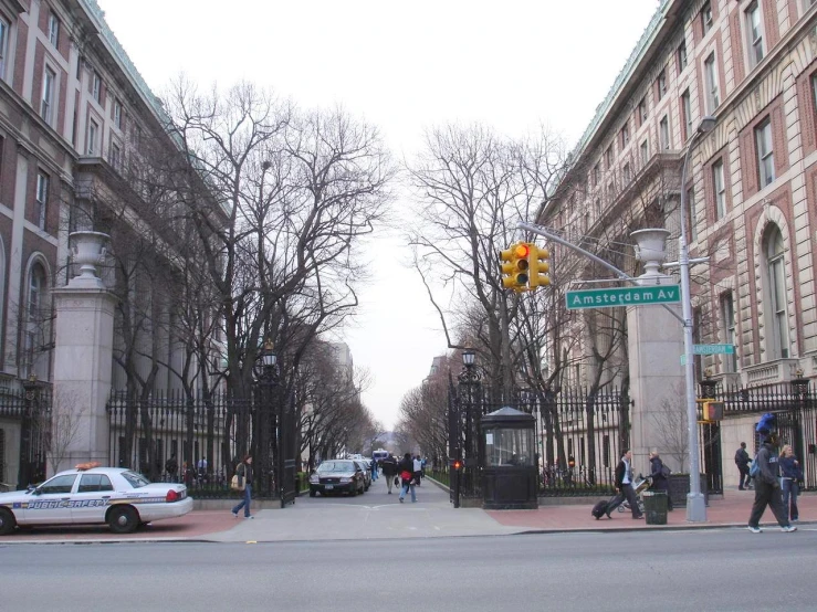 a city street with lots of tall buildings and lots of traffic