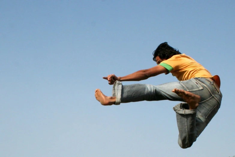 a man flying through the air while riding a skateboard