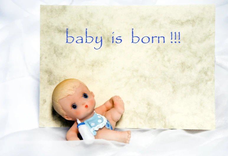 the baby is born sign is written above a doll