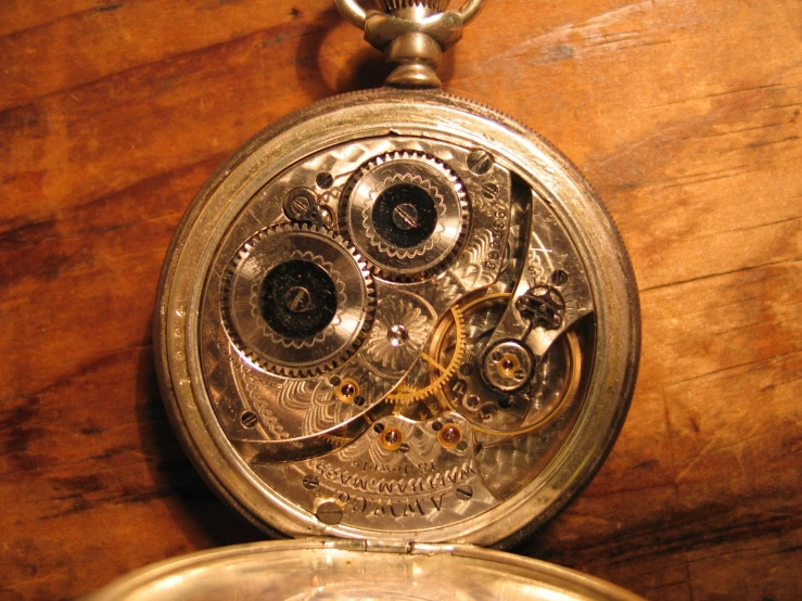 a close up of an old timey pocket watch