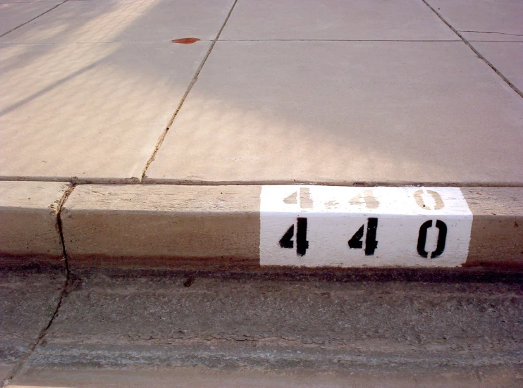 a street sign on a brick road saying 414