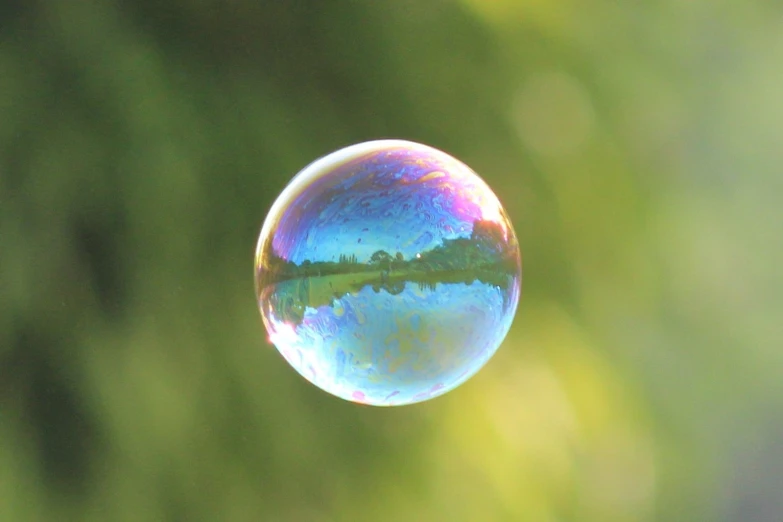 a bubble that is hanging from the side of a wall