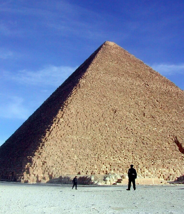 some people standing in front of the step pyramid