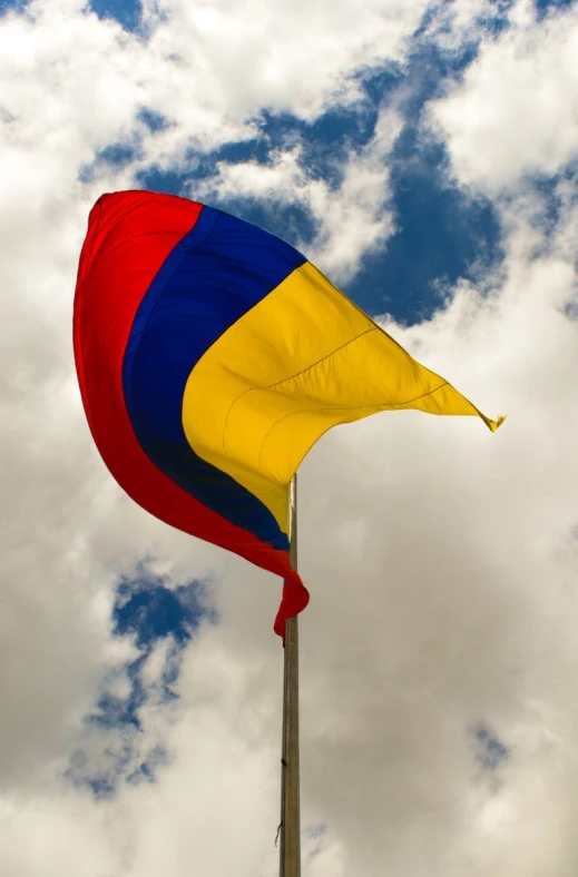 a red, yellow and blue waving flag
