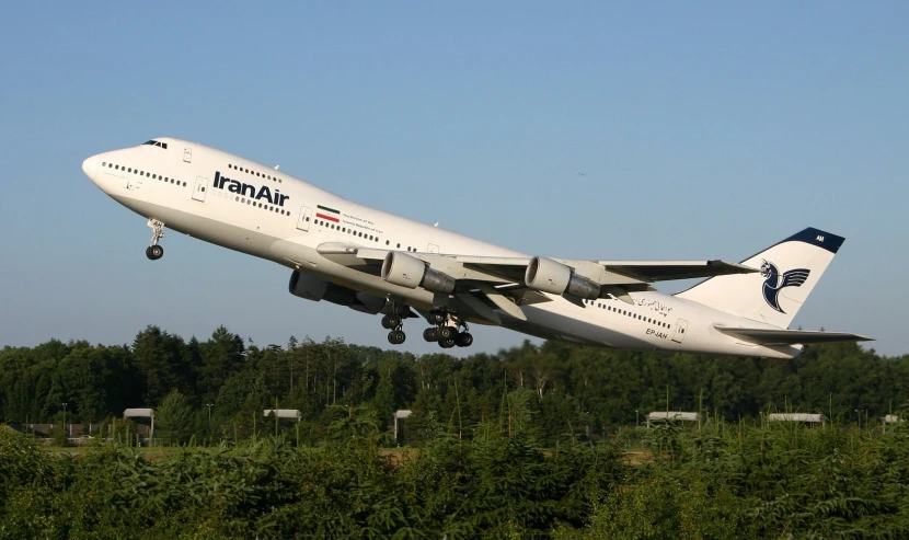 a large passenger plane that is in the air