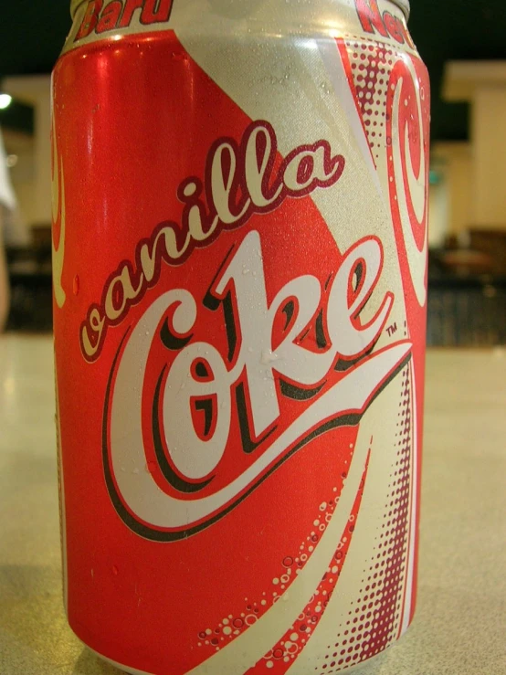 a very bright can of soda sitting on a counter