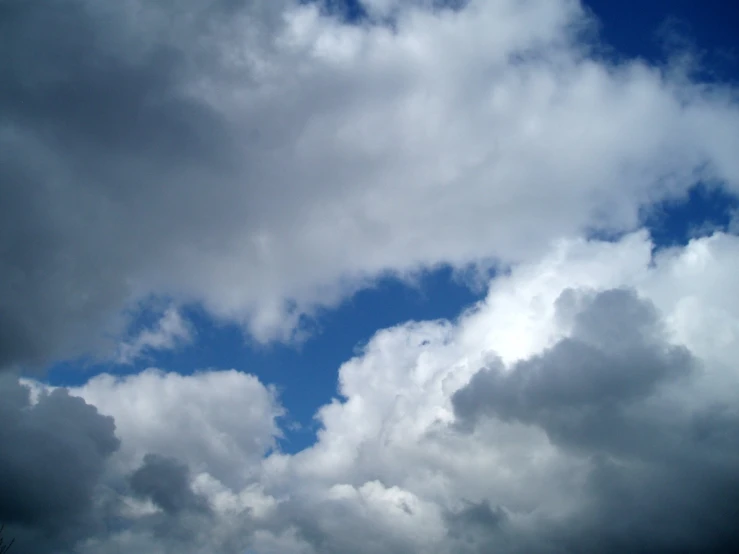 a airplane is flying thru an ominous sky