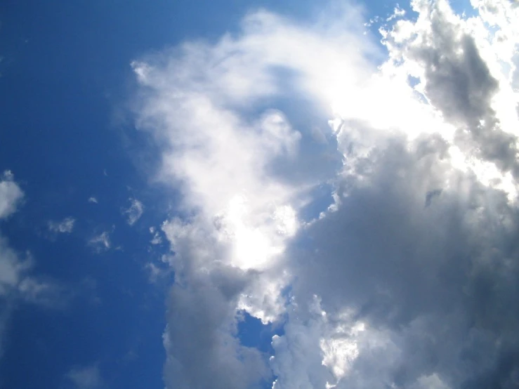 the bright blue sky is shown with a few clouds in it