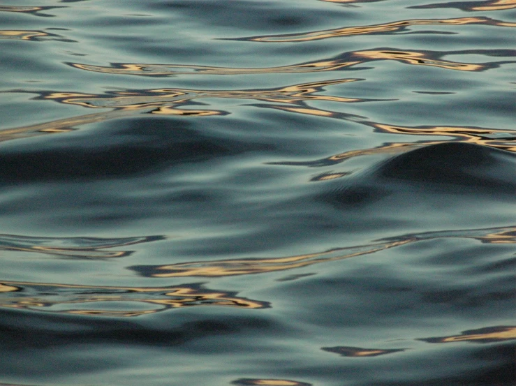 some very pretty water in the middle of the ocean