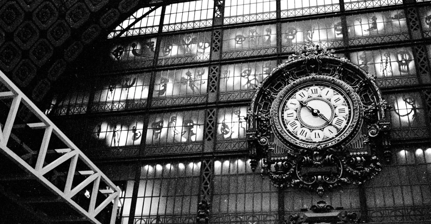 a picture of a clock in the middle of a station