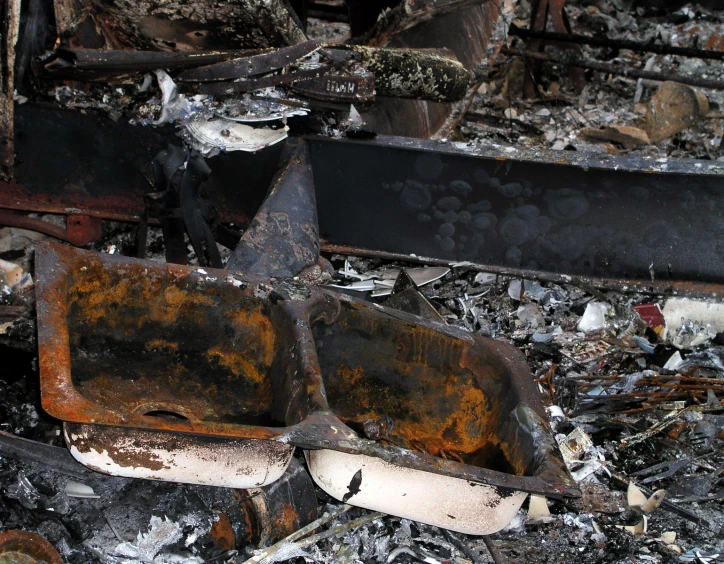 an area filled with burned and stained wood