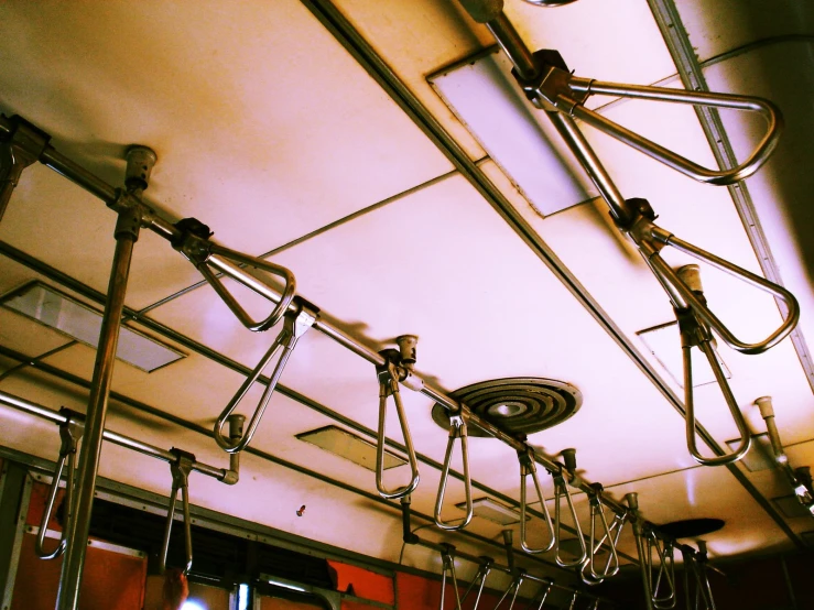 a train with several empty seat and wires